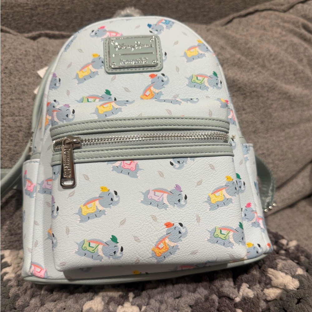 Disney Light Blue Dumbo backpack with Playful Animal Print. Brand New